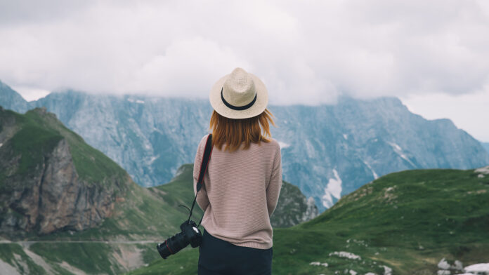 Young woman relaxing outdoor. Travel lifestyle